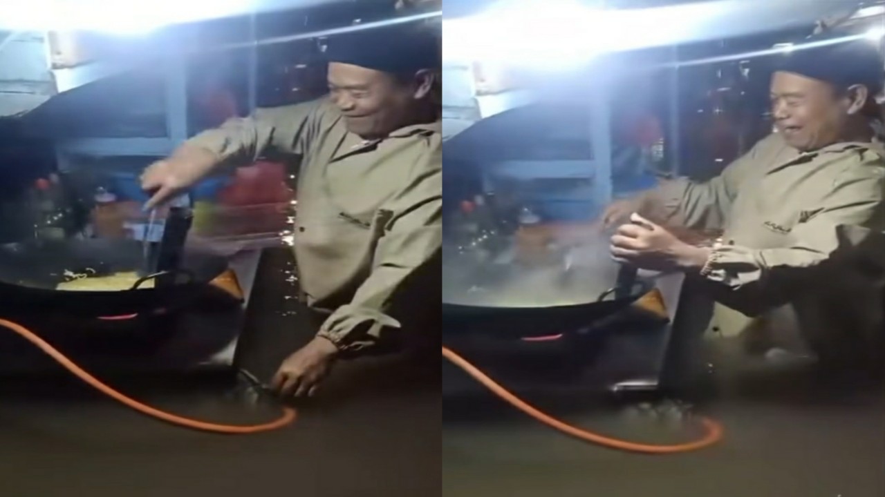 Viral Penjual Nasi Goreng Tetap Berjualan Meski Banjir Setinggi Pinggang, Warganet Salut